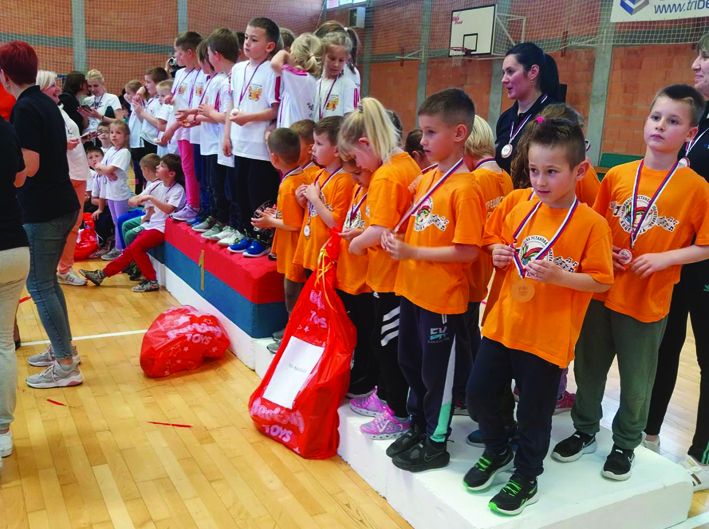 Okićeni medaljama i osmesima